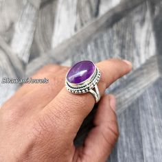 BhawaniJewelsAndGems Purple Amethyst Natural Ring, Sterling Silver Ring for Women, Statement Ring with Stone, Gemstone Boho Ring, Bohemian Jewelry Ring Style -> Band / Boho & Hippie Metal -> 925 Sterling Silver Ring Size - > All Sizes Are Available > Gift For Mom, Mother's Day Gift Ring A spinner ring, also known as a fidget ring or meditation ring, is a type of ring that features one or more outer bands that can rotate around the inner band of the ring. The outer bands may be made of a different material or have a different texture from the inner band, allowing for tactile stimulation and sensory feedback. Spinner rings are often used as a stress-relieving tool, as the repetitive motion of spinning the outer band can help to calm the mind and reduce anxiety. Some people also find spinner Bohemian Oval Jewelry With Accent Stones, Bohemian Rings With Gemstone Accents For Anniversary, Bohemian Anniversary Rings With Gemstone Accents, Purple Spiritual Crystal Ring, Bohemian Amethyst Ring As Gift, Bohemian Silver Amethyst Ring, Bohemian Purple Jewelry With Stone Setting, Bohemian Amethyst Ring, Purple Oval Bohemian Rings