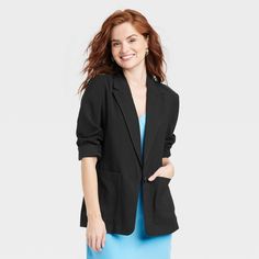 This Essential Blazer from A New Day™ makes a versatile addition to your off-duty or on-duty wardrobe. Made of a breathable fabric blend with partial lining, this long-sleeve blazer is rendered in a solid black shade that allows you to dress your ensemble up or down with just one piece. The single-breasted blazer with a notched collar and front button-down placket lends an elegant look, while the casual-fit silhouette with below-the-hip length and back vents allows for easy layering over your dr Effortless Outfit, Lightweight Blazer, Women Essentials, Long Sleeve Blazers, Linen Blazer, Casual Fit, Blazer Buttons, Black Blazer, Black Blazers