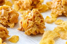 cornflakes are scattered around on a table