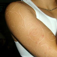 a woman's arm with white lines on it