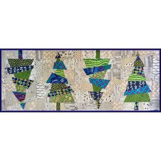 a quilted wall hanging with many different designs on it's sides and blue trim around the edges