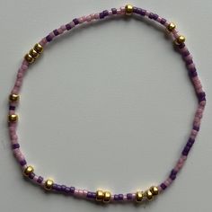 - made with various colors randomly mixed 3mm 14k gold - filled beads and 2mm seed beads - hand beaded bracelet made with elastic sting for a slight stretch to roll easily on and off your wrist  - measured standard (6.25") or extended (6.75") - stacks well with all bracelets Lavender Beaded Bracelet With Tiny Beads For Gifts, Adjustable Lavender Beaded Bracelets With Tiny Beads, Adjustable Lavender Bracelet With Tiny Beads, Purple Heishi Beaded Bracelets, Purple Heishi Beads Round Bracelets, Purple Stretch Bracelet With Tiny Beads As Gift, Lavender Beaded Bracelets With Tiny Round Beads, Adjustable Purple Heishi Beads Bracelets, Dainty Purple Beaded Bracelet