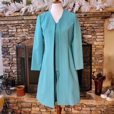 This Is A V-Neck Teal Dress Worn With The Long Open Jacket. It Is Custom Made And There Are "Ruffles" Near The Bottom Of The Dress (See Pictures). Size: No Size Bust: 17" Length: 36" Jacket: Length: 37" Armpit To Bottom Of Dress: 28 " Shoulder To Hand: 22" ; Armpit To Hand: 16" New Without Tags New Clothes Never Worn. Dry-Cleaning Only. Made In Korea Tailored Knee-length Jacket Dress For Spring, Fitted V-neck Outerwear For Formal Occasions, Tailored Jacket Dress With Notch Lapel For Spring, Fitted Knee-length Outerwear For Daywear, Elegant Blue Open Front Outerwear, Tailored Knee-length Spring Outerwear, Fitted Jacket Dress With Notch Lapel For Spring, Fitted Notch Lapel Jacket Dress For Spring, Fitted Knee-length Blazer For Fall