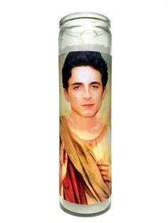 a candle with a photo of a young man on it