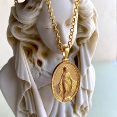 Miraculous Virgin Mary was a 1st century Galilean Jewish woman of Nazareth, and the wife of Joseph and the mother of Jesus. Your gold plated saint mary necklace looks very attractive and meaningful. Your blessed virgin mary necklace is double side and you can use both side to wear. Very special religious pendant gift for women and for men. Pendant Details: Nickel free hypoallergenic 22 carat gold plated You can use both side of the pendant (double side) We send your virgin mary necklace in a special gift pack Gender: Unisex Adult Pendant weight: 7-8 gram Pendant height: 1.80 inches (4.55cm) Pendant diameter: 0.98 inches (2.51cm) Pendant thickness: 0.080 inches (2mm) Chain type:  Box chain: 18 inches (45 cm): 8 gr 20 inches (50cm): 9,10 gr 24 inches (60cm): 10,9 gr Blessed Mother Necklace, Miraculous Medal Medallion Necklaces For Commemoration, Spiritual Necklace With Miraculous Medal For Commemoration, Miraculous Medal Medallion Necklace For Commemoration, Gold Our Lady Of Guadalupe Medallion, Spiritual Virgin Mary Medallion Jewelry, Gold Virgin Mary Medallion Charm, Gold Virgin Mary Medallion Jewelry, Gold Virgin Mary Medallion