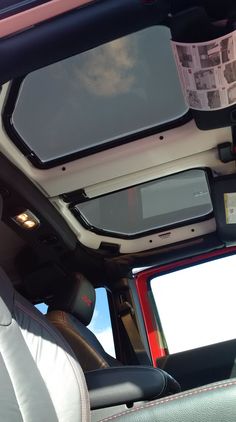 the interior of a vehicle with two monitors