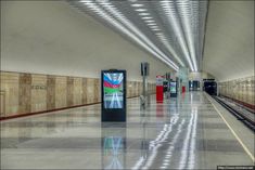 an empty train station with no people on the platform