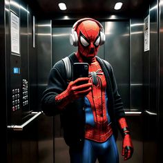 a man in a suit and headphones is looking at his cell phone while standing in an elevator