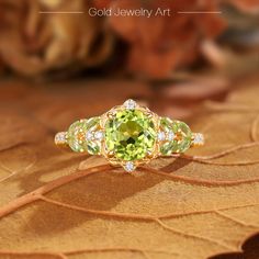 💎 Stone Specifications: 🌟 Main Stone: Green Peridot 🌟 Side Stones: Moissanite 🌟 Size of Main Stone: 6.5mm 🌟 Center Stone Carat: 1.5ct 🌟 Cut: Round cut 🔮 Materials Available: ＊ 925 Sterling Silver ＊ 925 Sterling Silver (Electroplated) ＊ 10K Gold ＊ 14K Gold ＊ 18K Gold ＊ Platinum 🎀 Contact us directly to customize your ring size or gemstone - bespoke services available upon request. 🎁 Packaging: Each ring is carefully placed in a beautifully curated gift box, ensuring a luxurious unboxing Luxury Gold Flower Cluster Ring, Peridot Birthstone Ring, Engagement Ring Marquise Cut, Cluster Wedding Ring, Engagement Ring Marquise, Flower Engagement, Marquise Cut Engagement Ring, Diamond Promise Ring, Ring Marquise