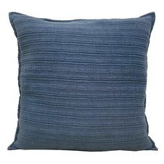 a blue pillow on a white background