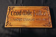 a wooden sign that says,'dead me face a hundred thousand welcome home '