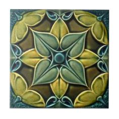 an artistic tile design with leaves on it