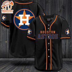 the houston astros baseball jersey is on display in front of a wooden wall with an orange star