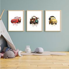 three cartoon cars are hanging on the wall in this children's room with wood flooring