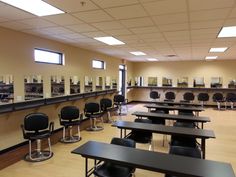 an empty room with tables and chairs in it