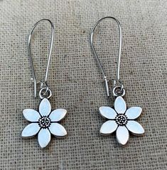 Sweet simple and pretty little flower dangle earrings.  Timeless and classic.  These dainty beauties are the perfect everyday understated earrings.  The earrings measure 5/8” long by 1/2” wide.  They hang from kidney style ear wires that lock and latch.  Overall drop length is 1 3/4”.  Made from allergy free plated silver.Thanks for stopping by!  Please take a moment and visit the rest of my Etsy shop.  I have many more unique jewelry designs to choose from!🌸 Tiger Flower Jewelry 🌸  🌸 Inspire Cute Flower Charm Earrings For Everyday, Cute Flower Shaped Earrings With Ear Wire, Cute Adjustable Flower Charm Earrings, Cute Everyday Earrings With Flower Charm, Cute Hypoallergenic Flower Shaped Earrings, Delicate Flower-shaped Earrings For Everyday, Cute Nickel-free Flower Shaped Earrings, Dainty Dangle Flower Earrings For Everyday, Delicate Hypoallergenic Dangle Flower Earrings