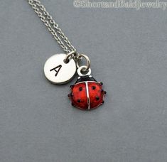 "* Ladybug charm in Silver plated and hand enameled. Approx: 7/16\" * Hand Stamped Initial Charm - Antique Silver Pewter 3/8\" (9mm) * Chain length - 16\", 18\", 20\" * Add a birthstone or Freshwater pearl for $3.50 https://www.etsy.com/listing/110444872 * Additional Hand Stamped Initial Charms $4.50 each: https://www.etsy.com/listing/107021419 * Go back to Short and Bald Jewelry http://www.etsy.com/shop/ShortandBaldJewelry * Your purchase will arrive attractively packaged and ready to give." Lady Beetle, Initial Charm, Initial Necklace, Hand Stamped, Freshwater Pearls, Charm Necklace, Antique Silver, Initials, Monogram