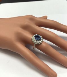 4.75 Carats Natural Very Nice Looking Tanzanite and Diamond 14K Solid White Gold Ring Suggested Replacement Value: $8,000.00 Total Natural Oval Cut Tanzanite Weight is: 3.50 Carats Tanzanite Measures: 9.00 x 7.00mm Natural Round Diamonds Weight: 1.25 Carats (color G-H / Clarity SI1-SI2) Ring total weight: 5.8g Disclaimer: all weights, measurements and colors are approximate and may vary slightly from the listed dimensions or as seen in the image. All pictures are magnified to show the smallest o Estate Style Formal Rings With Gemstones, Formal Oval Estate Jewelry, Estate Style Gemstone Wedding Rings, Estate Oval Diamond Ring With Hallmark, Estate Style Gemstone Rings For Anniversary, Estate Style Oval Hallmarked Diamond Ring, Estate Oval Hallmarked Diamond Ring, Formal Oval Estate Diamond Ring, Estate Oval Wedding Jewelry