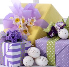 several gift boxes with flowers and eggs on them