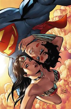 superman and wonder woman in front of the sky with clouds behind them, as if they were kissing