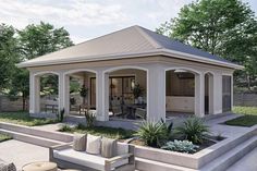 a gazebo sitting on top of a lush green field next to a stone patio