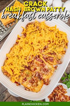 a casserole dish with cheese and bacon in it on a white platter