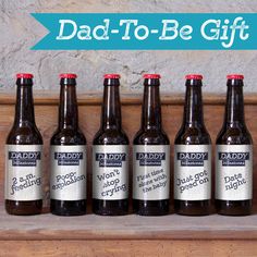 six brown beer bottles sitting on top of a wooden shelf