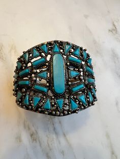 Vintage Navajo style faux turquoise cuff bracelet In excellent condition  Measures 2" at widest Western Turquoise Bangle Cuff Bracelet, Western Style Turquoise Bangle Cuff Bracelet, Western Style Blue Cuff Bangle Bracelet, Southwestern Style Bangle Cuff Bracelet For Festivals, Vintage Turquoise Cuff Bracelet For Festival, Turquoise Vintage Cuff Bracelet For Festival, Navajo Style, Turquoise Bracelet Cuff, Turquoise Cuff