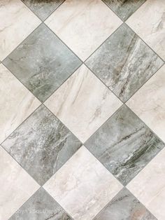 a tile floor with grey and white squares