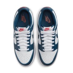 The Nike Dunk Low Valerian Blue is your go-to option for everyday street style. Crafted with smooth white leather overlaid with deep Valerian Blue and subtle hits of red, this sneaker offers a classic and versatile look that you can rock all year long. Plus, the matching white and blue Air sole ensures comfort for all your daily adventures. Whether you're out to explore or just getting around town, the Nike Dunk Low Valerian Blue has you covered! Classic Navy Nike Sneakers, Classic Blue Skate Shoes With Rubber Sole, Classic Blue Low-top Skate Shoes, Navy Leather Custom Sneakers For Streetwear, Classic Leather Sneakers With Padded Tongue, Classic White Sneakers With Padded Tongue, Nike Custom Navy Leather Sneakers, Custom Navy Leather Nike Sneakers, Nike Dunk Low Valerian Blue