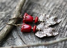 These dark red naturally antiqued floral earrings are lightweight and hypoallergenic. Earthy boho woodland feel in a hard to find rich red matched with bronze. Works well casual or dressy, day to night. Made with naturally antiqued nickel free brass ear wires or you can opt for ultra hypoallergenic niobium ear wires. Gift box is included. Jewelry Boho, Hypoallergenic Earrings, Floral Earrings, Bohemian Jewelry, Boho Jewelry, Dark Red, Jewelry Earrings Dangle, Gift For Her, Dangle Drop Earrings