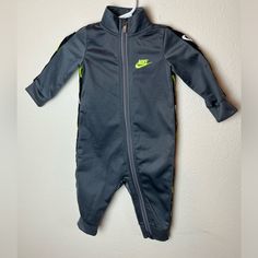 Nike Kid Jumpsuit. Dark Gray With Neon Nike Logo On The Black Trim And Dark Gray Lighting Bolts. Nwot No Flaws Noticed Pet-Friendly Home 6 Months 62-68cm Neon Nike Logo, Neon Nike, Gray Jumpsuit, Grey Lighting, Grey Jumpsuit, Nike Neon, Jumpsuit For Kids, Nike Kids, Kids Nike