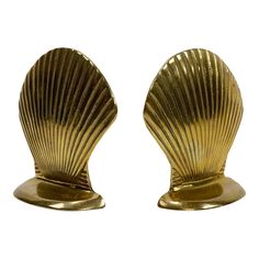 pair of brass shell bookends on white background