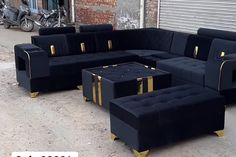 black and gold couches in front of a building