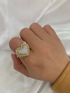 Beautiful heart ring in 14k solid gold, contains white cubic zirconias that add brightness to the piece, it is size 7 but we can make it to the measure you need, send a message if you have a question, item sold by piece, weight undetermined. Luxury 14k Gold Heart Ring With Vs Clarity, Luxury Cubic Zirconia Heart Promise Ring, Fine Jewelry Heart Ring With Pave Setting As Gift, White Gold Heart Ring With Diamond, 14k Diamond Heart Ring, White 14k Gold Heart Shaped Ring, Heart Ring With Pave Setting As Gift, Diamond Heart Ring With Accents For Gift, Luxury Heart Ring With Vs Clarity For Promise