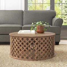 a living room with a gray couch and coffee table in front of a large window