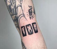 a man's arm with some tattoos on it