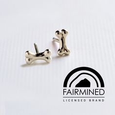 Dog bone stud earring Cute as can be! Add these to your ear party or wear them alone. Our little white gold dog bones are 6mm long and are made with  #Fairmined gold. Fairmined gold helps support miners and their families. Fairmined is an assurance label that certifies gold from empowered responsible artisanal and small-scale mining organizations. It transforms mining into an active force for good, ensuring social development and environmental protection, providing everyone with a source of gold Ear Party, Forest Hills, Dog Bones, Social Development, Dog Bone, Environmental Protection, Stud Earring, Jewelry Earrings Studs, Gold Earrings