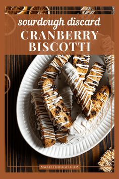 a white plate topped with cranberry biscotti