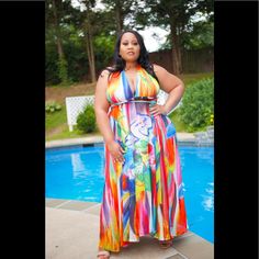 Kimora Maxi Dress Features A Sexy Halter Neckline That Crosses At The Back And Wraps Around The Waist Where It Ties Into A Flowy Bow. The Multicolor Print And The Open Back Make The Dress A Sexy, Eye-Catching Piece Multicolor Maxi Dress For Summer Night Out, Chic Multicolor Maxi Dress For Beach Party, Vibrant Print Sundress Maxi Dress For Party, Vibrant Print Sundress For Party, Party Sundress With Vibrant Print, Multicolor Halter Neck Maxi Dress For Party, Vibrant Fitted Maxi Dress For Summer, Vibrant Summer Maxi Dress For Parties, Summer Party Vibrant Maxi Dress