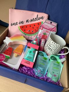 an open box with various items in it and a pink bag next to it that says, one in a melon