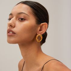 The Oh Factor Gold Earrings are all about striking balance—bold yet minimal, modern yet timeless. Featuring a sculptural, open-loop design, these earrings give a refined edge to any look. Their high-polish gold finish shines effortlessly against the skin, making them the ultimate statement piece without feeling overdone. Whether you’re going for casual or upscale, these earrings bring a touch of artistic flair that elevates your vibe instantly. Creative Texture, Texture Metal, New Chic, Popular Jewelry, Gold Piece, Body Chain Jewelry, Stylish Jewelry, Chains Jewelry, Shape Patterns