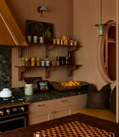 a kitchen filled with lots of counter space next to a stove top oven and microwave