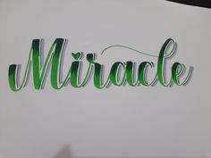 the word mirage written in green ink on white paper