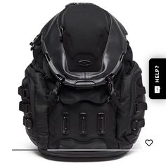 the back side of a black backpack with two different zippers and buttons on it