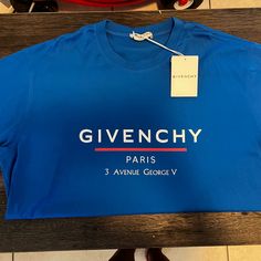 Givenchy Blue Mens Shirt Luxury Blue Shirt For Summer, Luxury Blue Cotton Tops, Luxury Blue Tops For Summer, Designer Blue Tops For Spring, Luxury Blue Shirt, Luxury Blue Summer Shirt, Designer Blue Tops With Logo Print, Designer Blue Crew Neck Top, Luxury Blue Short Sleeve Top