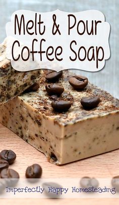 a bar of soap sitting on top of a wooden table with coffee beans around it