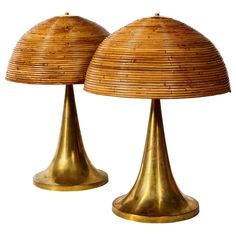 two brass lamps with bamboo shades on each one lamp has a wicker dome shade