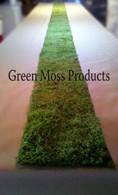 green moss products are lined up on a long table with the words green moss products written across it