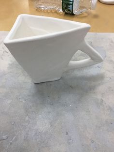 a white bowl sitting on top of a table